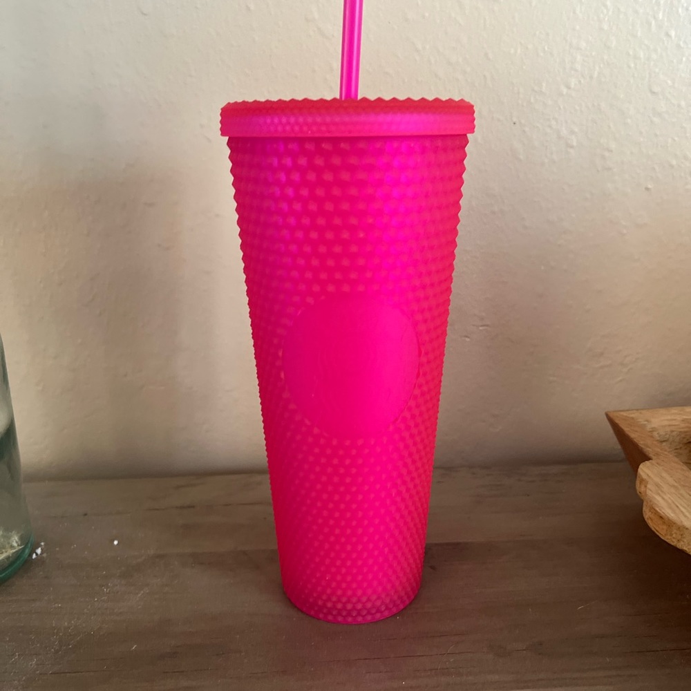 Neon pink studded Starbucks cup